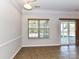 Dining area with neutral walls, tile floors, and sliding glass door to the backyard at 15506 Lakepoint Forest Dr, Charlotte, NC 28278