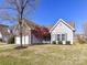 Charming single-Gathering home with a two-car garage, stone accents, and a well-maintained lawn at 15506 Lakepoint Forest Dr, Charlotte, NC 28278