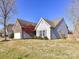 Well-kept single-Gathering home featuring vinyl siding, an attached two-car garage, and mature landscaping at 15506 Lakepoint Forest Dr, Charlotte, NC 28278