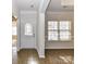 Entrance hall featuring tile flooring, a decorative front door, and a view into the dining area at 15506 Lakepoint Forest Dr, Charlotte, NC 28278
