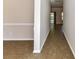 Spacious hallway features tiled flooring, neutral wall paint, and leads to other rooms at 15506 Lakepoint Forest Dr, Charlotte, NC 28278