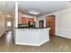 Stylish kitchen offers a breakfast bar, and a seamless transition into the dining and living spaces at 15506 Lakepoint Forest Dr, Charlotte, NC 28278