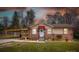 Charming brick home with a red awning, covered carport, and well-manicured lawn at 198 33Rd Nw St, Hickory, NC 28601