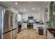Modern kitchen featuring stainless steel appliances, granite countertops, and stylish tile flooring at 198 33Rd Nw St, Hickory, NC 28601