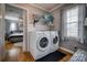 Convenient laundry room with a washer and dryer, offering easy access to the main bedroom through an open doorway at 198 33Rd Nw St, Hickory, NC 28601
