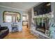 Cozy living room with a charming fireplace, hardwood floors, and open view to the kitchen provides a welcoming and connected living space at 198 33Rd Nw St, Hickory, NC 28601