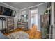 A well-furnished main bedroom with a large TV, wooden furniture, hardwood floors, and a stylish round rug on the floor at 198 33Rd Nw St, Hickory, NC 28601