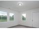 Bright bedroom featuring hardwood flooring, large windows, and fresh paint at 201 Lee Black Rd, Cherryville, NC 28021