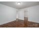 Bedroom featuring hardwood flooring, fresh paint and two entry doors at 201 Lee Black Rd, Cherryville, NC 28021
