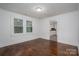 Bedroom with hardwood flooring, fresh paint and a view into the kitchen at 201 Lee Black Rd, Cherryville, NC 28021