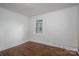 Simple bedroom with wood floors, white trim and window overlooking yard at 201 Lee Black Rd, Cherryville, NC 28021
