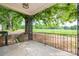 Covered front porch featuring decorative wrought iron railings and view of lawn at 201 Lee Black Rd, Cherryville, NC 28021