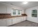 Kitchen featuring wood counters, tiled back splash, stainless steel sink and white cabinets at 201 Lee Black Rd, Cherryville, NC 28021