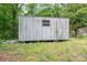A rectangular outbuilding is constructed of what appears to be corrugated metal siding with a small window at 201 Lee Black Rd, Cherryville, NC 28021