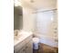 Bright bathroom with a white vanity, toilet, and a tub/shower combination at 2035 Talbert Ct, Charlotte, NC 28214