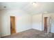 Neutral bedroom with carpet flooring, two closets, and natural light from the windows at 2035 Talbert Ct, Charlotte, NC 28214