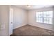Bedroom features carpet, natural light, and neutral color paint at 2035 Talbert Ct, Charlotte, NC 28214