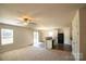 Open-concept living area featuring modern lighting, adjacent kitchen with granite countertops at 2035 Talbert Ct, Charlotte, NC 28214