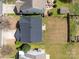 Aerial view of a private backyard with a dark roof, well-maintained lawn, and mature trees, providing seclusion at 2319 Arbor Vista Dr, Charlotte, NC 28262
