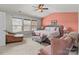 Serene main bedroom featuring a vaulted ceiling, large windows, and a cozy seating area for relaxation at 2319 Arbor Vista Dr, Charlotte, NC 28262
