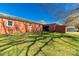 A spacious backyard featuring a brick home with a fenced-in patio area and a covered area at 260 Trexler Ln, Rock Hill, SC 29732