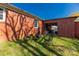 Backyard showcasing a brick house and patio set with a firepit enclosed by black fence, perfect for outdoor living at 260 Trexler Ln, Rock Hill, SC 29732
