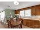 Functional eat-in kitchen with wood cabinetry, stainless appliances, and a cozy dining area at 260 Trexler Ln, Rock Hill, SC 29732