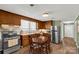 Eat-in kitchen with stainless steel appliances, wood cabinets, and a dining table at 260 Trexler Ln, Rock Hill, SC 29732