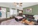 Bright living room featuring a cozy sofa, a decorative rug, and a large window at 260 Trexler Ln, Rock Hill, SC 29732