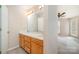 Spacious bathroom featuring double sinks, a large mirror with vanity lighting, and plenty of counter space at 329 Northwest Dr, Davidson, NC 28036