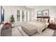 Bright bedroom with a large window, neutral decor, and a comfortable upholstered bench at 329 Northwest Dr, Davidson, NC 28036