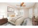 Inviting bedroom with a patterned rug, wooden furniture, and a cozy bed setup at 329 Northwest Dr, Davidson, NC 28036