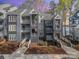 Modern condo building with multiple units, outdoor stairways and walkways, and lake access at 329 Northwest Dr, Davidson, NC 28036