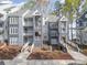 Beautiful condo building with lake view, featuring private balconies and well-maintained landscaping at 329 Northwest Dr, Davidson, NC 28036