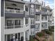 Exterior elevation featuring a tiered balcony at 329 Northwest Dr, Davidson, NC 28036