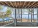 Beautiful lake view from a covered porch overlooking a community pool at 329 Northwest Dr, Davidson, NC 28036