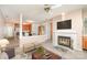 Cozy living room with fireplace, adjacent to the kitchen and dining area in an open concept layout at 329 Northwest Dr, Davidson, NC 28036