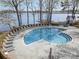 Community pool surrounded by lounge chairs and a scenic lake view at 329 Northwest Dr, Davidson, NC 28036