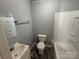 Bright and clean bathroom featuring a shower-tub combo and a pedestal sink at 3316 Queens Ln # 10, Gastonia, NC 28052