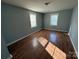 Sunlit bedroom with hardwood flooring and neutral walls at 3316 Queens Ln # 10, Gastonia, NC 28052