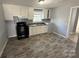 Functional kitchen featuring white cabinets and modern appliances at 3316 Queens Ln # 10, Gastonia, NC 28052