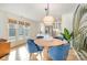 Charming dining area with modern lighting and a view of the updated kitchen at 336 Northwest Dr, Davidson, NC 28036
