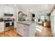Modern kitchen boasts a large island, stainless steel appliances, and seamless flow to living areas at 336 Northwest Dr, Davidson, NC 28036