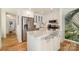 Modern kitchen with granite island, stainless steel appliances, and hardwood flooring at 336 Northwest Dr, Davidson, NC 28036