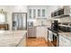 Well-equipped kitchen featuring stainless steel appliances, white cabinets, and updated countertops at 336 Northwest Dr, Davidson, NC 28036