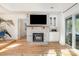 Cozy living room with a brick fireplace, built-in cabinets, and easy access to the outdoors at 336 Northwest Dr, Davidson, NC 28036