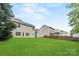 Large grassy back yard with fencing and shade trees at 3725 Catawba Creek Dr, Gastonia, NC 28056