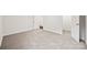 Carpeted bedroom with an open door showing wood floors, white baseboards and walls at 3725 Catawba Creek Dr, Gastonia, NC 28056
