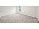 Bright bedroom with plush gray carpet, white walls and baseboards, and a window at 3725 Catawba Creek Dr, Gastonia, NC 28056