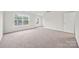 Spacious bedroom with neutral carpet and two windows for natural light at 3725 Catawba Creek Dr, Gastonia, NC 28056